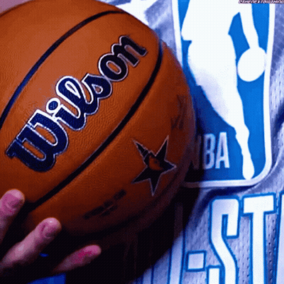 Person Holding Wilson Basketball In Front Of NBA Logo GIF