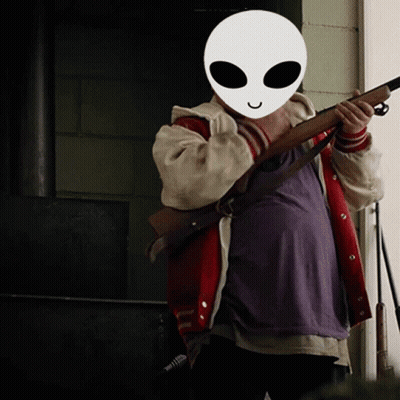 Person In Alien Mask Holding Rifle GIF