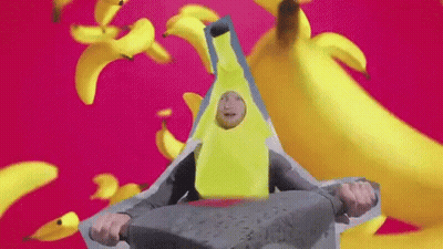Person In Banana Costume Sitting On Rock GIF
