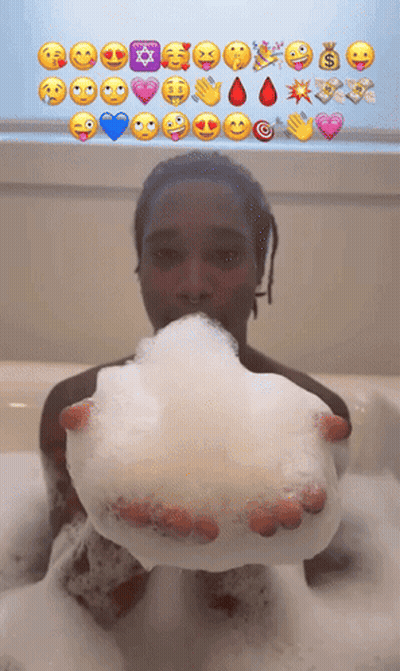 Person In Bathtub Holding Soap Bubble With Emojis GIF