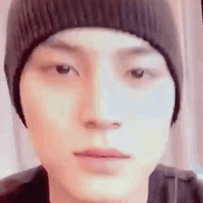 Person In Beanie Looking At Camera GIF