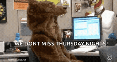Person In Bear Costume Sitting At Computer In Office GIF