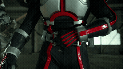 Person In Black And Red Costume With 00000 Belt GIF