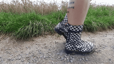 Person In Black-And-White Checkered Boots With Peace Tattoo GIF
