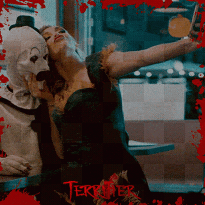 Person In Black And White Clown Costume In Crowd GIF