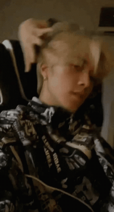 Person In Black And White Jacket With Supreme Lanyard GIF