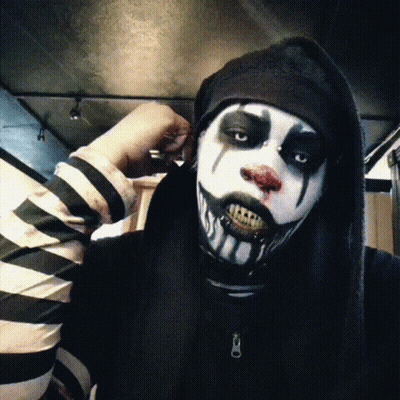 Person In Black And White Striped Shirt And Clown Makeup GIF
