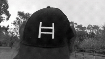 Person In Black Baseball Cap With Letter H GIF