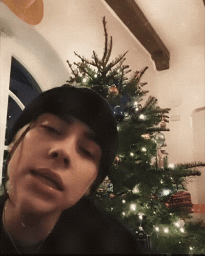 Person In Black Beanie With Christmas Tree GIF