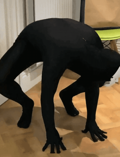 Person In Black Bodysuit Bending Over GIF