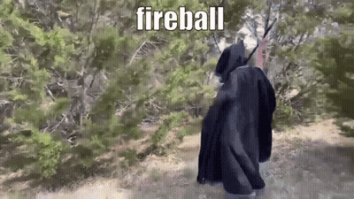 Person In Black Cloak Walking Forest Fireball GIF