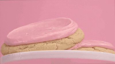 Person In Black Gloves Frosting Cookie GIF