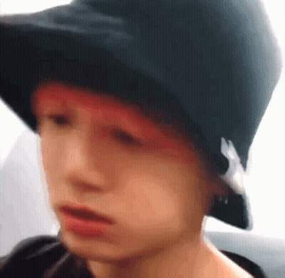 Person In Black Hat With Red Hair GIF