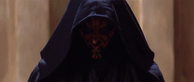 Person in Black Hooded Robe with Red Face
