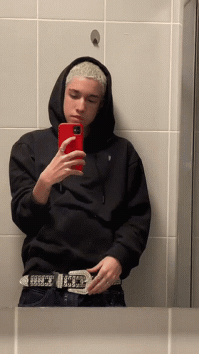 Person In Black Hoodie Taking Selfie GIF