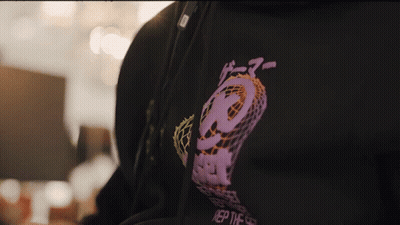 Person In Black Hoodie With Purple Logo Saying Rep GIF