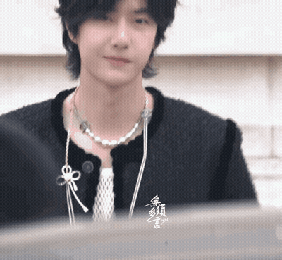 Person In Black Jacket And Pearl Necklace GIF