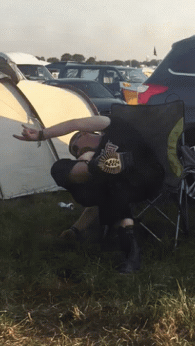 Person In Black Leaf Shirt On Folding Chair GIF