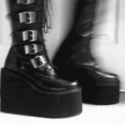Person In Black Platform Boots With Buckles GIF