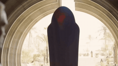 Person In Black Robe In Front Of Large Window GIF