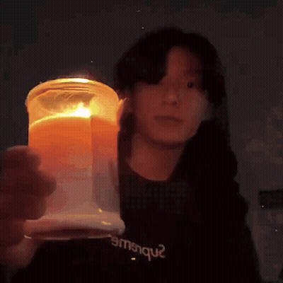 Person In Black Shirt Emsique Holding Candle GIF