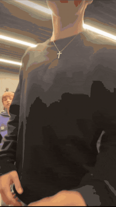 Person In Black Shirt With Cross GIF
