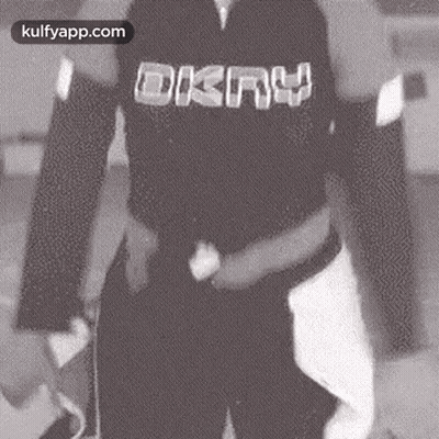 Person In Black Shirt With DKNY GIF