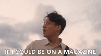 Person In Black Shirt With W Standing In Front Of Trees GIF