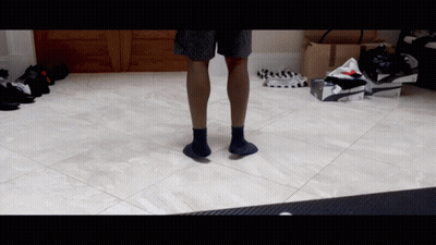 Person In Black Socks Standing GIF