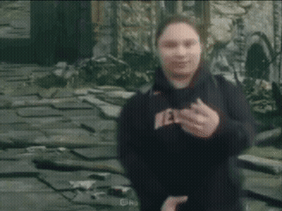 Person In Black Sweatshirt With Letter R Blurry GIF