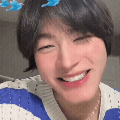 Person In Blue And White Striped Sweater And Necklace GIF