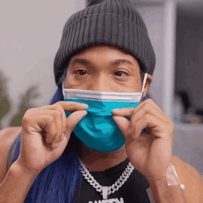 Person In Blue Face Mask And Black Tank Top GIF