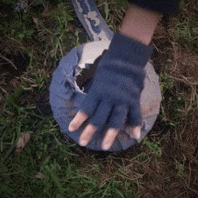 Person In Blue Glove Holding Cloth With Letter E GIF