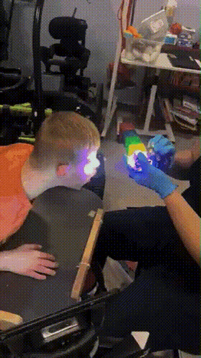 Person In Blue Gloves Holding Cube GIF