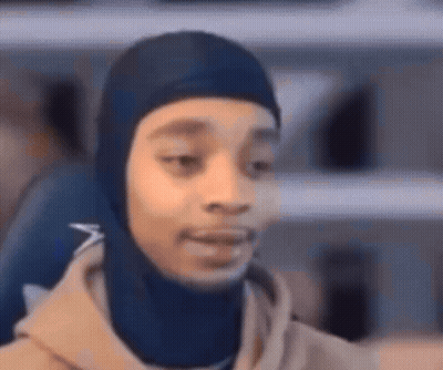 Person In Blue Hooded Hat Close Up GIF
