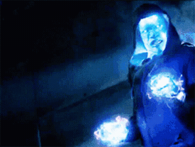 Person In Blue Hoodie Surrounded By Glowing Lights GIF
