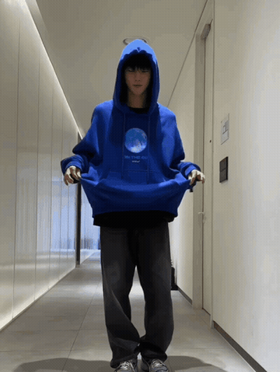 Person In Blue Hoodie With Globe GIF