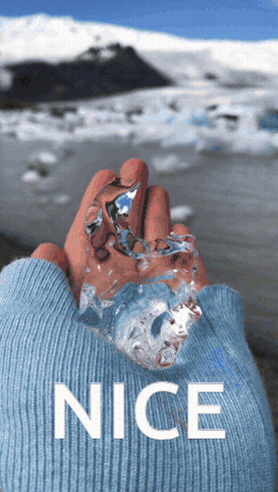 Person In Blue Sweater Holding Ice GIF