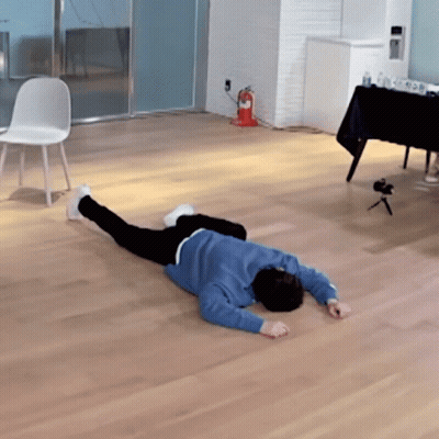 Person In Blue Sweater Lying Down GIF