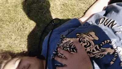Person In Blue Tiger Shirt Lying On Back GIF