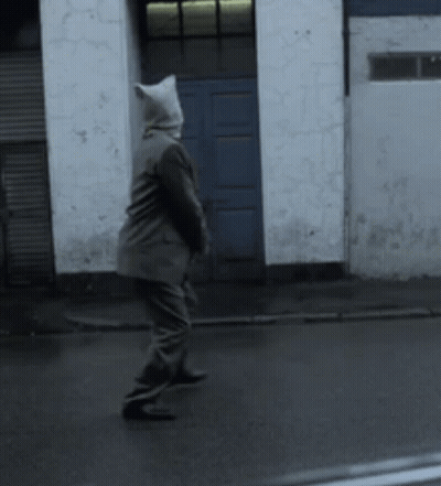 Person In Cat Hood Walking Down Street GIF
