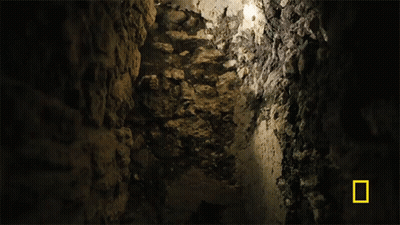 Person In Cave With National Geographic Logo GIF