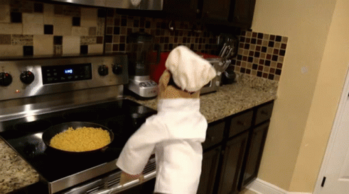 Person In Chef Hat Cooking Macaroni And Cheese GIF