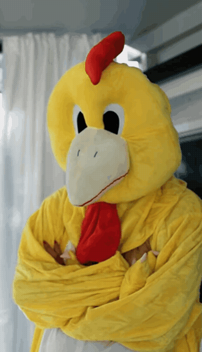 Person In Chicken Mascot Costume With Arms Crossed GIF