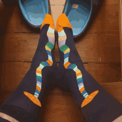 Person In Colorful Socks With Yellow Soles GIF