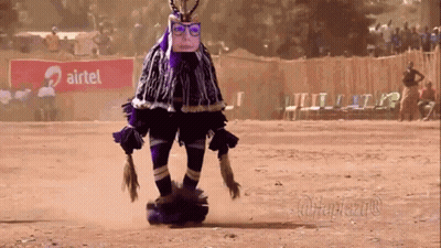 Person In Costume In Front Of Airtel Sign GIF