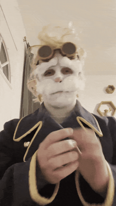 Person In Costume With White Face And Goggles GIF