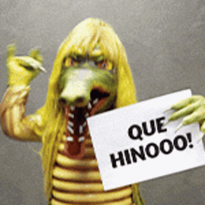 Person In Crocodile Costume Holding Sign Que Hinooo GIF