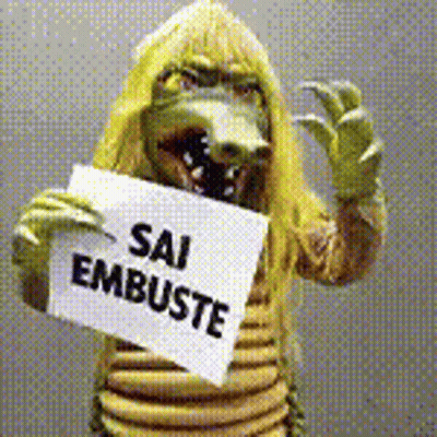 Person In Crocodile Costume Holding Sign Sai Embuste GIF