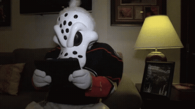 Person In Dalmatian Mask Using Tablet GIF